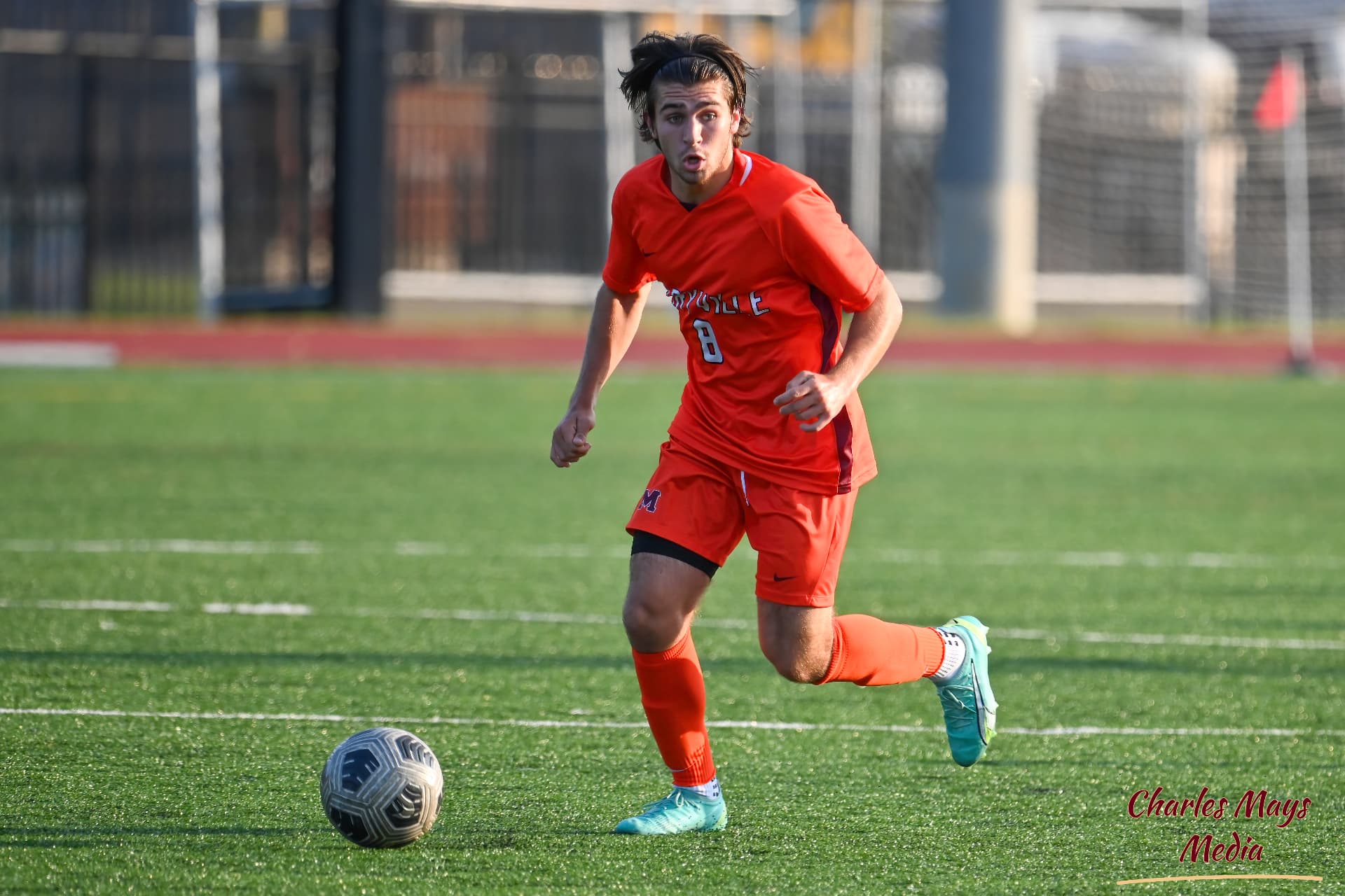 Coach Aidan McWilliams driving forward with the ball