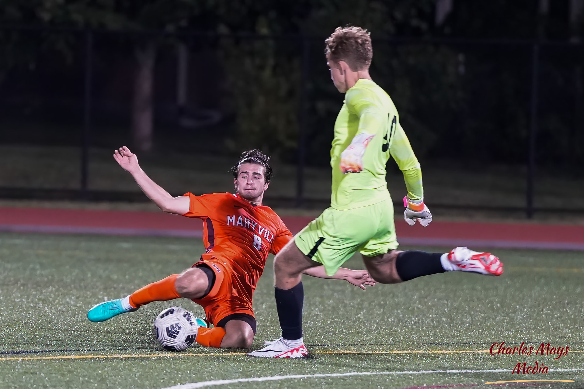 Coach Aidan McWilliams winning a tackle in a night match